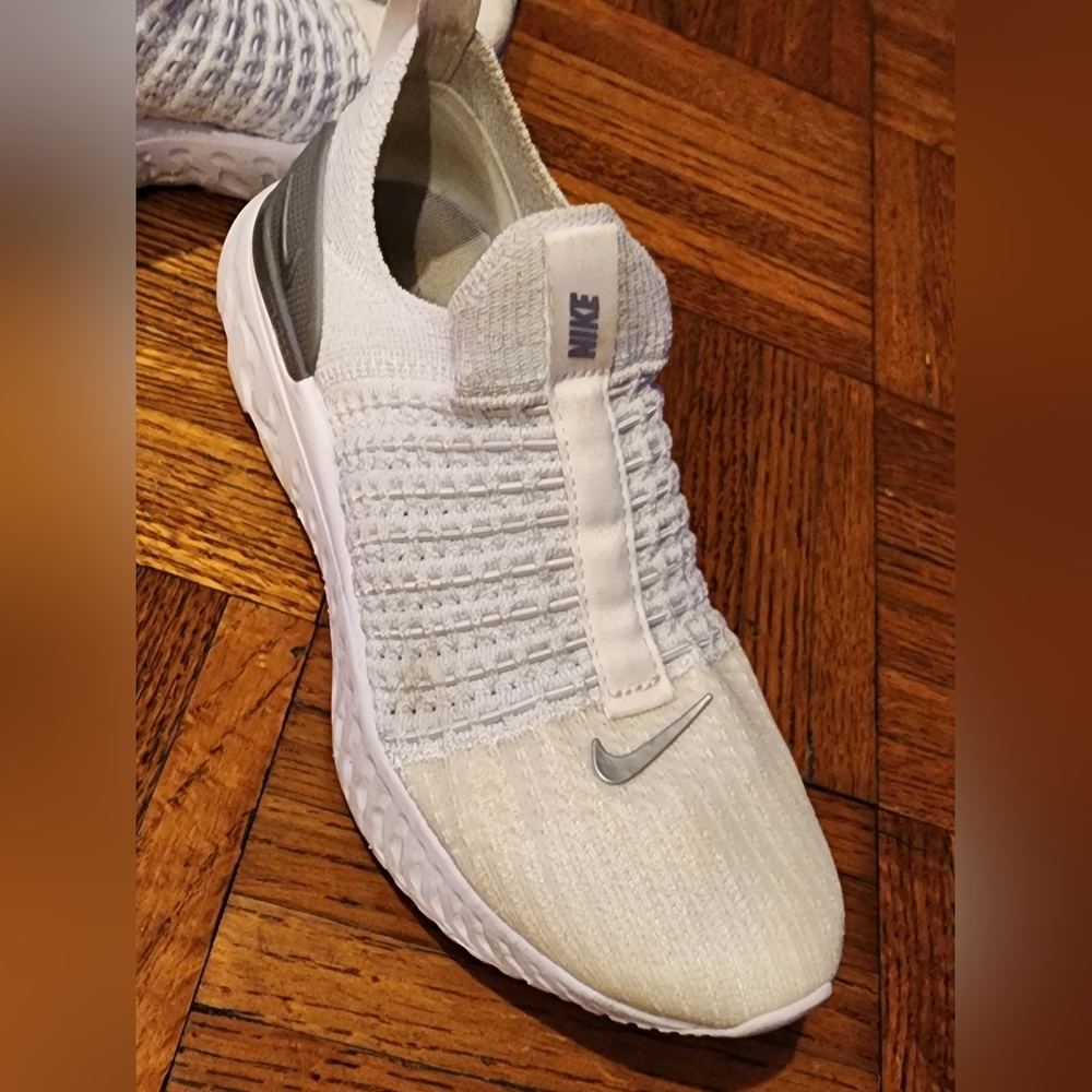 Women's Nike react fly knit white with silver logo size 5.5